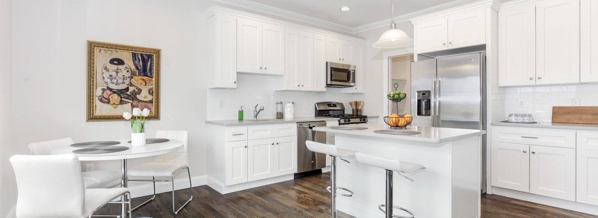 view of townhome kitchen with white marble appliances